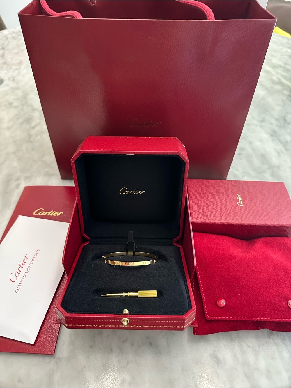 Cartier Yellow Gold Love Bangle on Red Pouch